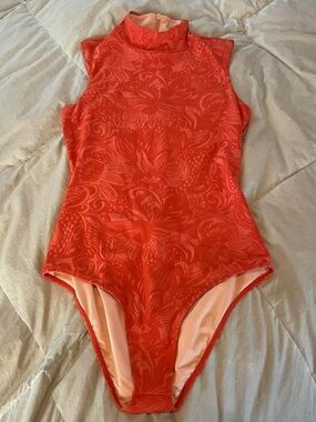 The Seea “Mandarina” surf suit one piece bathing suit.